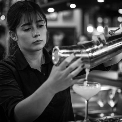 A bartender at Valentina's Italian prepares drinks behind the bar