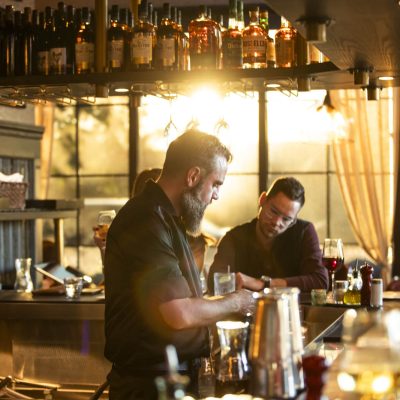 A bartender at Valentina's Italian prepares drinks behind the bar