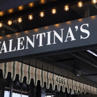 Raised signage at the front door of Valentina's restaurant in Dublin, Ohio at Bridge Park.