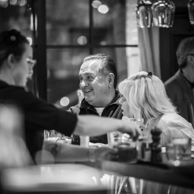 Two guests sit at the bar at Valentina's Italian
