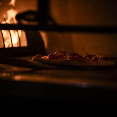 A pepperoni pizza from Valentina's Italian baking in the oven