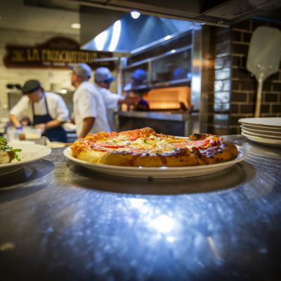 A pepperoni pizza from Valentina's Italian sitting at expo
