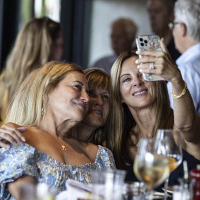 Trio of women taking a selfie at their table at Valentina's restaurant in Dublin, Ohio at Bridge Park.