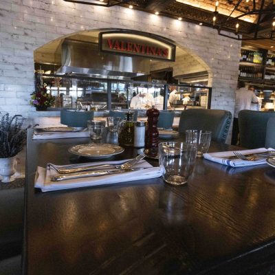 View of the open kitchen with wood-fired pizza oven at Valentina's restaurant in Dublin, Ohio at Bridge Park.
